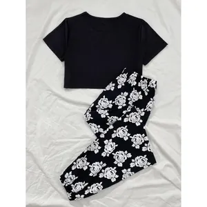 Women's summer pajamas set with black short sleeve crop top and rose floral pants