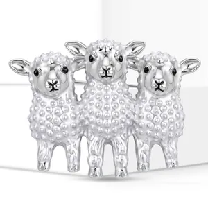 Detailed view of silver three-lamb brooch animal pin with cute embossed texture design