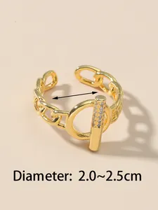Close-up of golden open chain ring featuring micro-set zircon toggle and adjustable diameter.