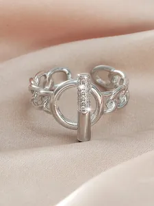 Macro view of silver adjustable ring featuring paved cubic zirconia stones in circle design