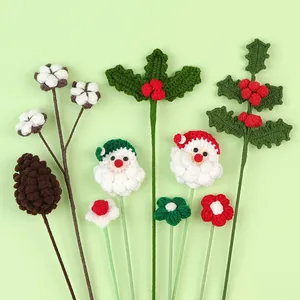 Handmade knitted Christmas stems featuring Santa Claus, cotton, and holly berry details.