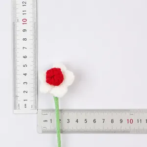 Close-up of a handmade crochet yarn flower decoration for Christmas bouquets and crafts