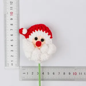 Crochet Santa Claus flower branch decoration with ruler measurement and weight detail