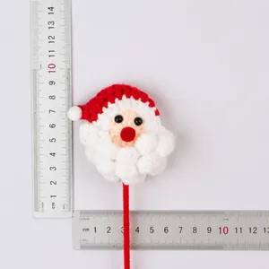 Hand-crocheted Santa Claus flower stick decoration with weight and size details.