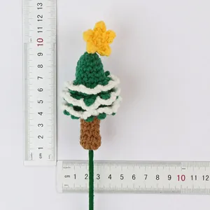 Hand-knit crocheted Christmas tree flower pick with ruler measurements and weight