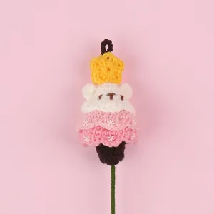 Detailed view of hand-knitted crochet bear star flower decoration for festive bouquets