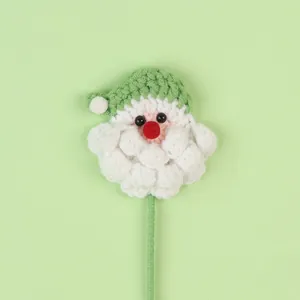 Handmade crochet Santa Claus head on a green stem for Christmas bouquet decoration
