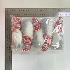Pack of 5 Christmas gnome plush dolls in plastic bag with ruler for size reference