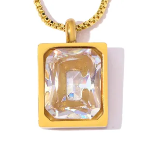 Close-up of luxury gold-plated stainless steel pendant featuring a large letter C zircon stone
