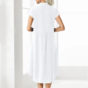 Back view of a white cotton linen midi dress with a minimalist stand collar design