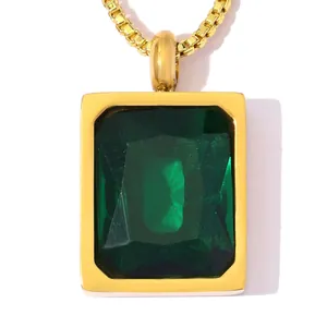 Detail view of a luxury rectangular emerald green zircon pendant in gold stainless steel