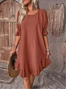 Vintage rusty orange cotton-linen midi dress featuring ruffle sleeves and a flowing ruffled hemline