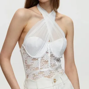 Elegant white lace bodysuit featuring a halter neck and intricate floral corset details.