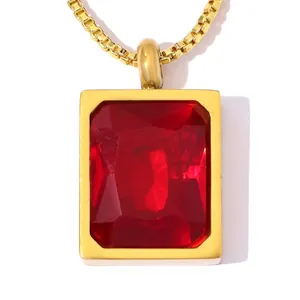 Detail view of rectangular red zircon pendant in gold-plated stainless steel