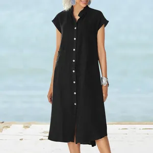 Full front view of a black stand collar linen midi dress showing white buttons and pocket