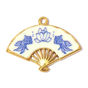 Detail view of fan-shaped stainless steel pendant with blue lotus and goldfish enamel