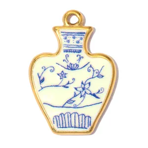 Close-up of stainless steel blue and white porcelain vase pendant with floral design