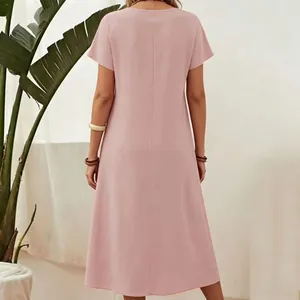 Back view of a minimalist pink short-sleeve cotton linen maxi dress with round neck