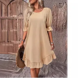 Vintage beige cotton linen dress with puff sleeves and ruffled hem for summer wear.