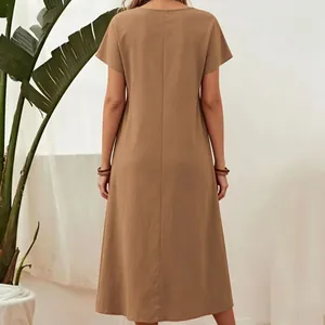 Detailed rear view of a minimalist solid brown cotton linen short sleeve midi dress