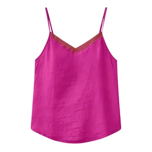 Close-up of elegant pink cotton-linen camisole top featuring sheer organza V-neckline detail
