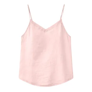 Detail view of light pink cotton linen camisole with thin spaghetti straps and V-neckline