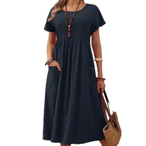 Casual navy blue cotton linen dress with short sleeves, pleated front and side pockets.