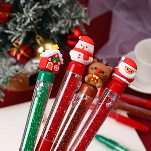 Macro detail of Christmas-themed cartoon gel pens with sparkling diamond bead filling