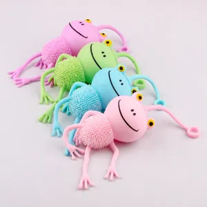 Macro detail of colorful cartoon frog squeeze toys with spiky texture for stress relief