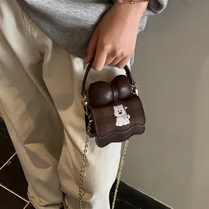 Mini brown crossbody bag with decorative bow and cute cartoon dog print for women