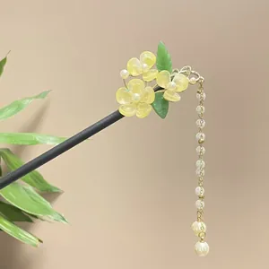 Elegant Hanfu style sandalwood hair stick featuring yellow flowers and a long pearl tassel