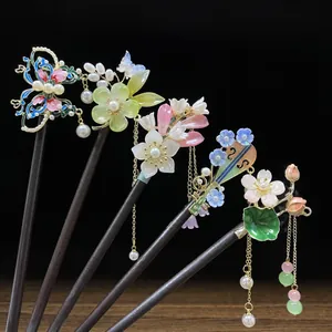 Five exquisite wooden hairpins with floral and tassel details for Hanfu hair styling.