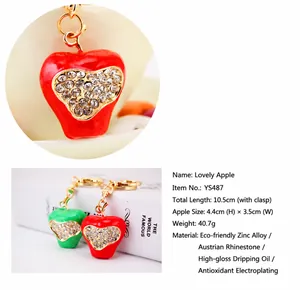 Detailed view of a rhinestone apple keychain with full size and material specifications
