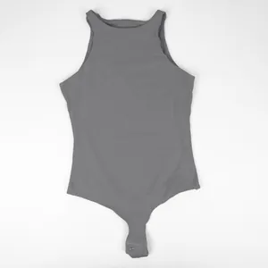 High-quality detailed view of sleeveless gray shapewear bodysuit with snap closure