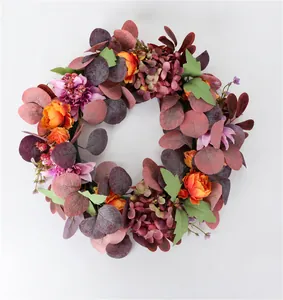 Frontal view of autumn artificial wreath with silk peonies and hydrangeas for home decor