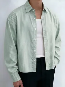 Close-up detail of a men's light green vertical striped long sleeve casual shirt