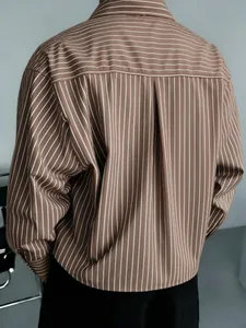 Rear view of brown and white striped men's loose-fit long-sleeve casual shirt