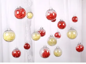 Clear hanging Christmas ornaments with vibrant red and yellow shredded paper fillers