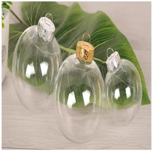 Detail of transparent plastic Christmas balls with decorative gold and silver caps.
