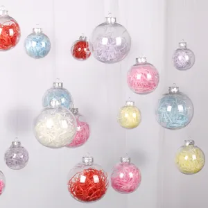 Detailed view of clear Christmas ornaments with vibrant colorful shredded paper filling.