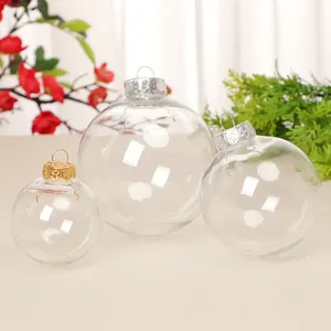 Set of three clear plastic Christmas baubles with decorative gold and silver metal caps