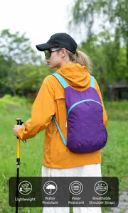Detailed view of a professional lightweight purple outdoor backpack worn during hiking