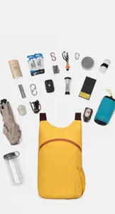 Lightweight yellow hiking backpack showing large storage capacity with various outdoor gear.