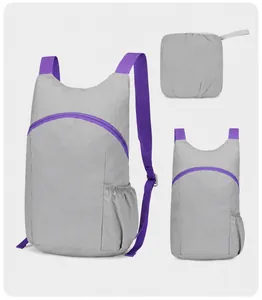 Lightweight grey foldable backpack with purple straps and storage pouch
