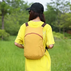 Lightweight yellow hiking backpack for outdoor sports, trekking and camping usage