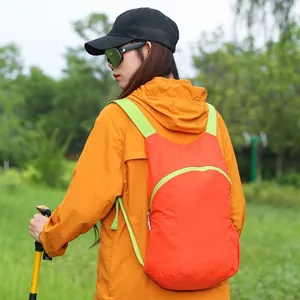 Lightweight orange outdoor hiking backpack for camping and trekking with large capacity.