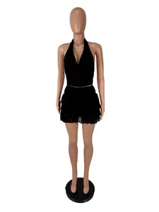 Full view of a sexy black halter top and ruffled mini skirt set on a mannequin