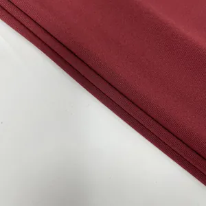 Detailed close-up showing high-quality maroon ribbed knit fabric texture for elegant women dresses