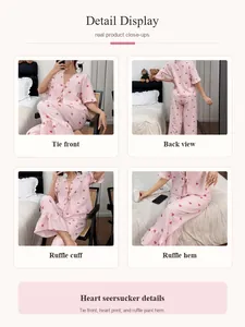 Detailed view of pink heart print seersucker pajama set featuring ruffles and tie front