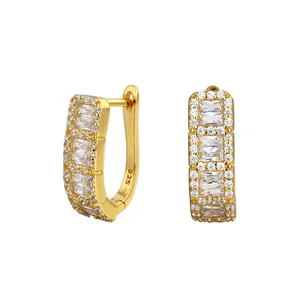 Detailed view of S925 gold hoop earrings with sparkling baguette cubic zirconia stones